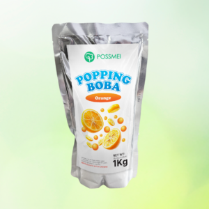 Possmei popping boba orange flavor in a 1kg silver pouch with fresh citrus design on a light green background.