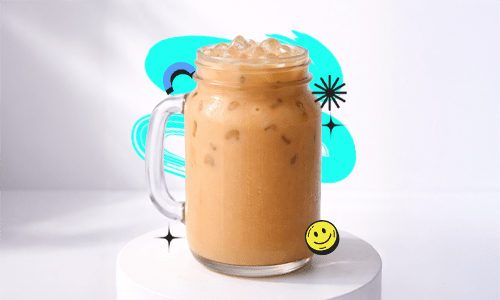 A creamy Bubble Tea Wintermelon Recipe drink in a mason jar with ice placed on a white podium with a bright aesthetic background