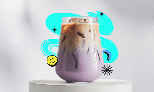 A creamy dreamy taro milktea in a clear cup with rich purple color, topped with milk foam and served cold